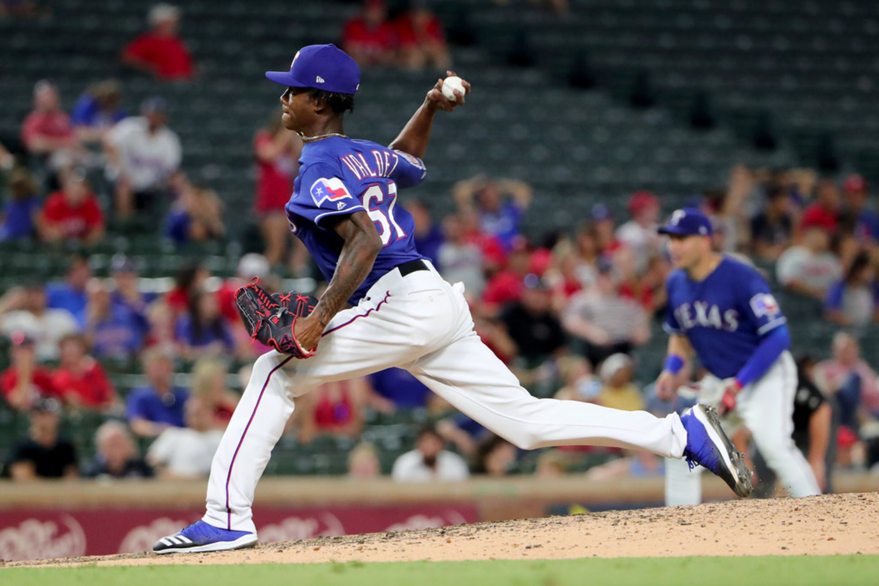 ARLINGTON, TEXAS - JULY 16: Phillips Valdez #67 of the Texas Rangers pitches against the...