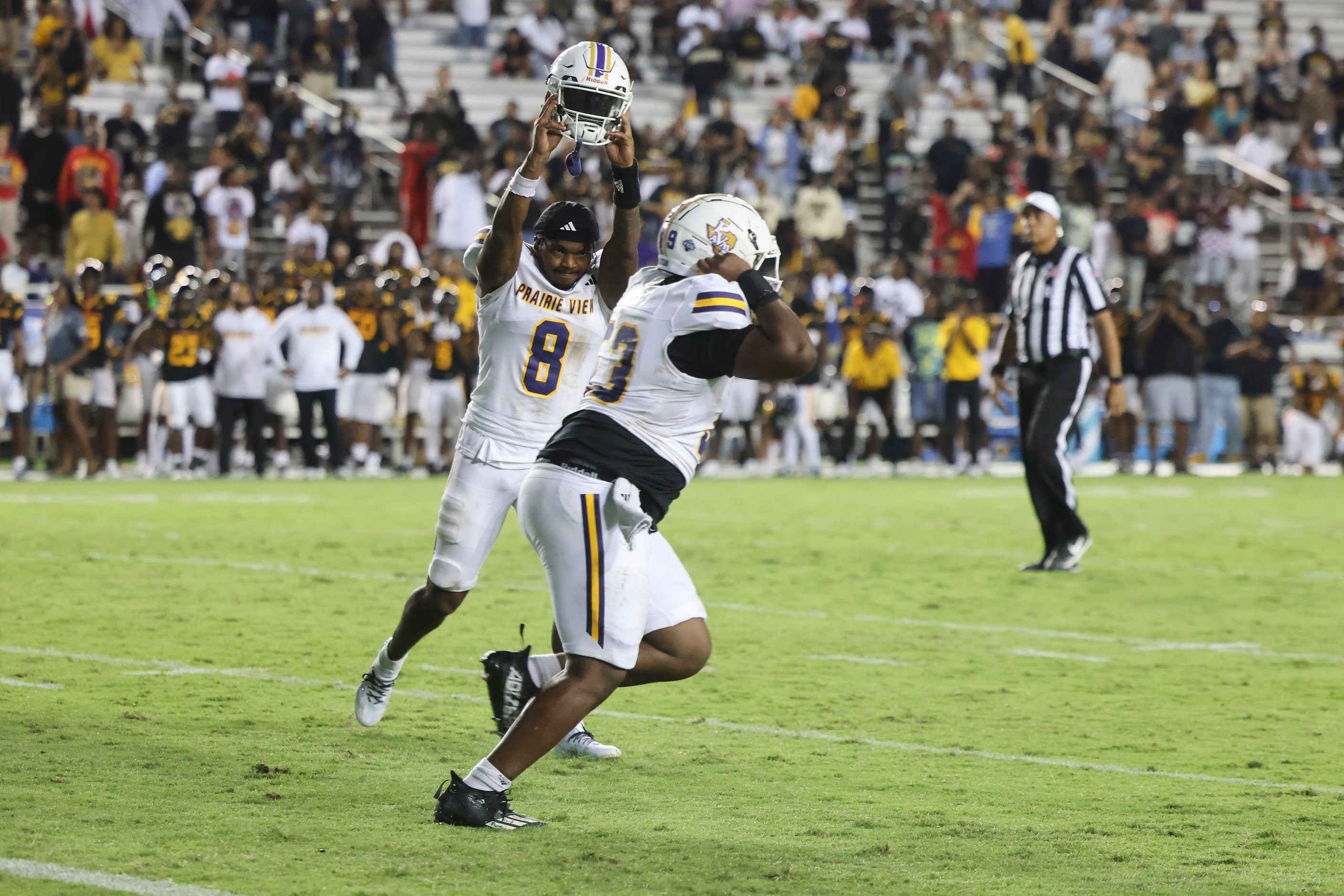 Prairie View A&M players celebrate after the overtime win  against Grambling State in the...