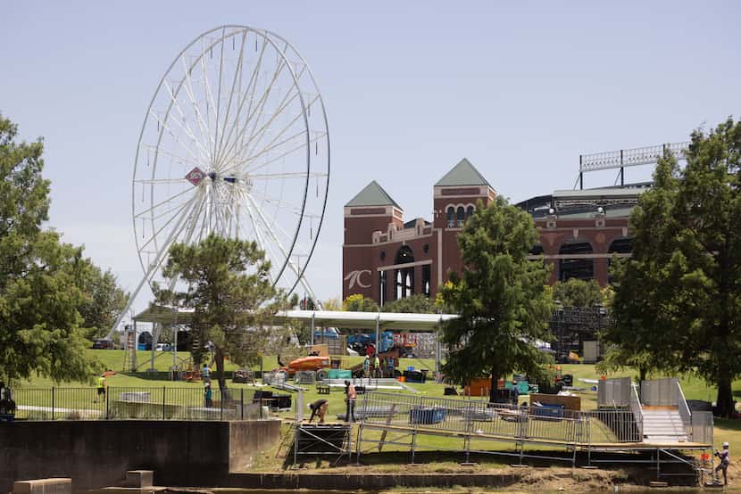Construction continues around the Ferris wheel in the planned MLB All-Star Village outside...