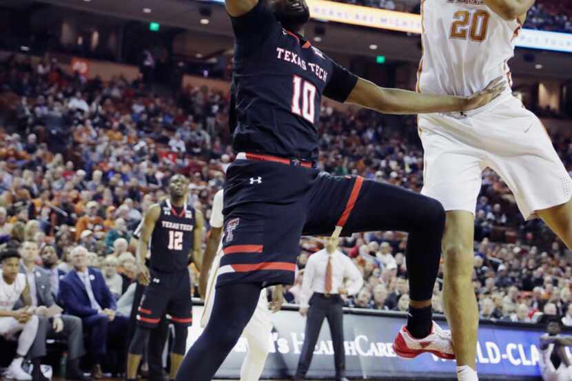 Texas Tech guard Niem Stevenson (10) loses control of the ball as he tries to score past...