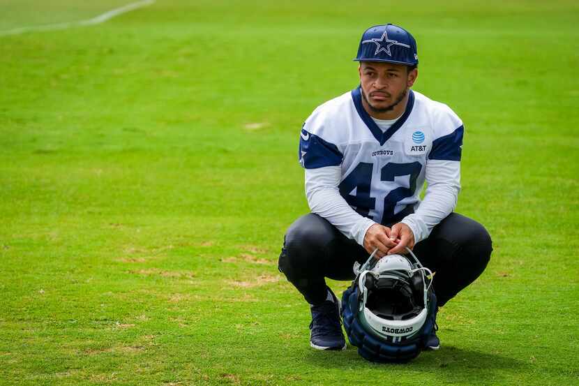 Dallas Cowboys running back Deuce Vaughn pauses between activities during a training camp...
