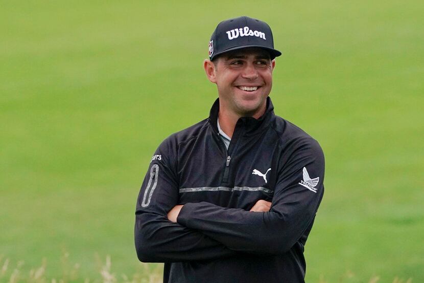 Gary Woodland smiles after finishing the second round in the U.S. Open golf tournament...