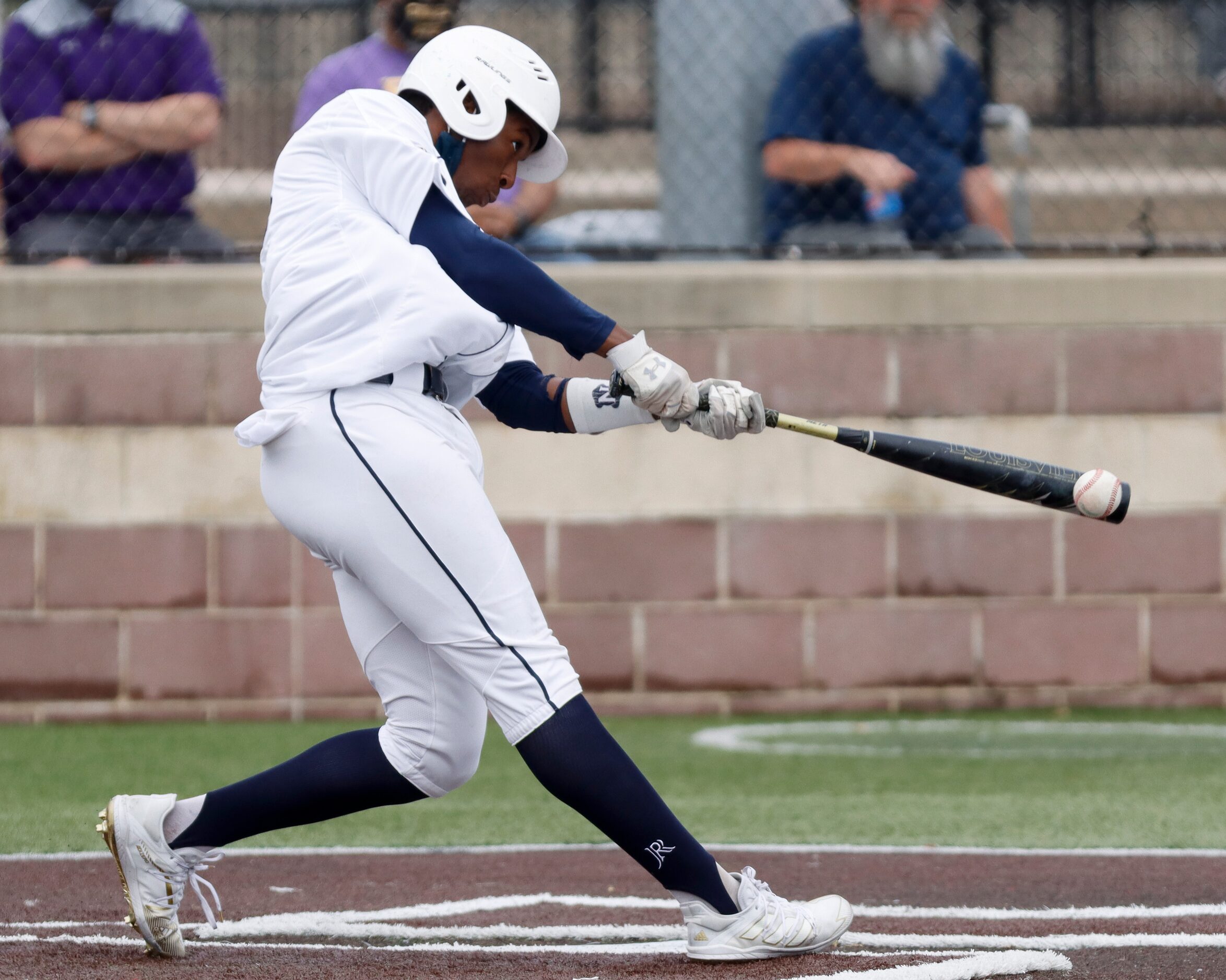 Jesuit left fielder Myles Tucker hits the ball during a district 7-6A game against...