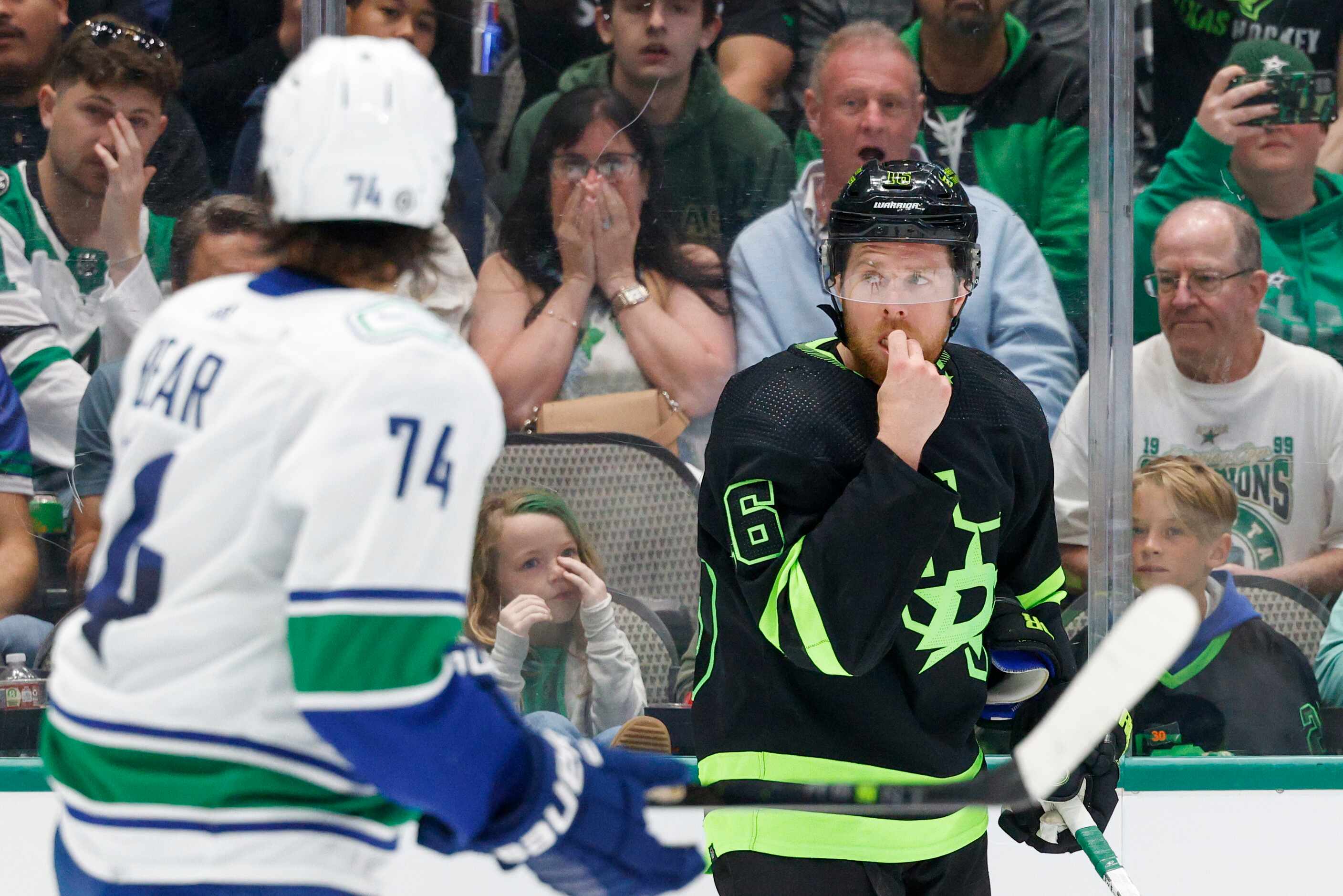Dallas Stars center Joe Pavelski (16) grabs his lip after being hit with a high stick during...
