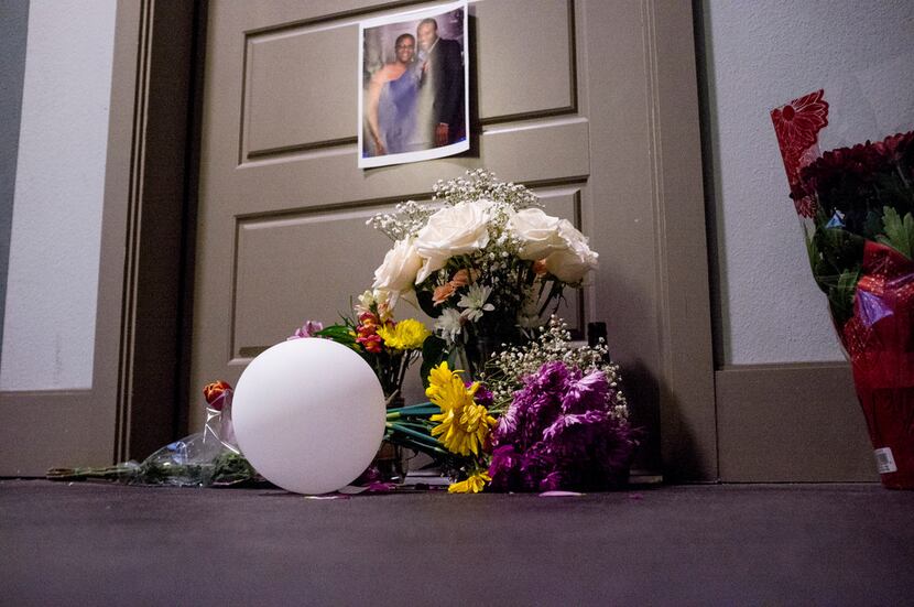 Flowers at the front door of Botham Shem Jean, who Dallas police say was shot Thursday by...
