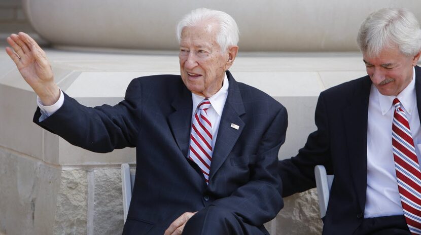 Ralph Hall (left) waved to the crowd as he and his son, Brett Hall, attended an event to...