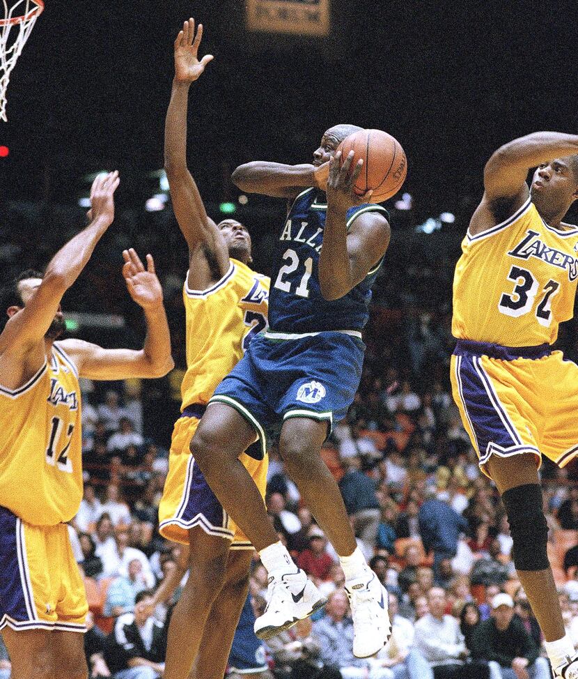 Dallas MavericksÃ­ George McCloud attempts to pass Los Angeles Lakers, from left Vlade...