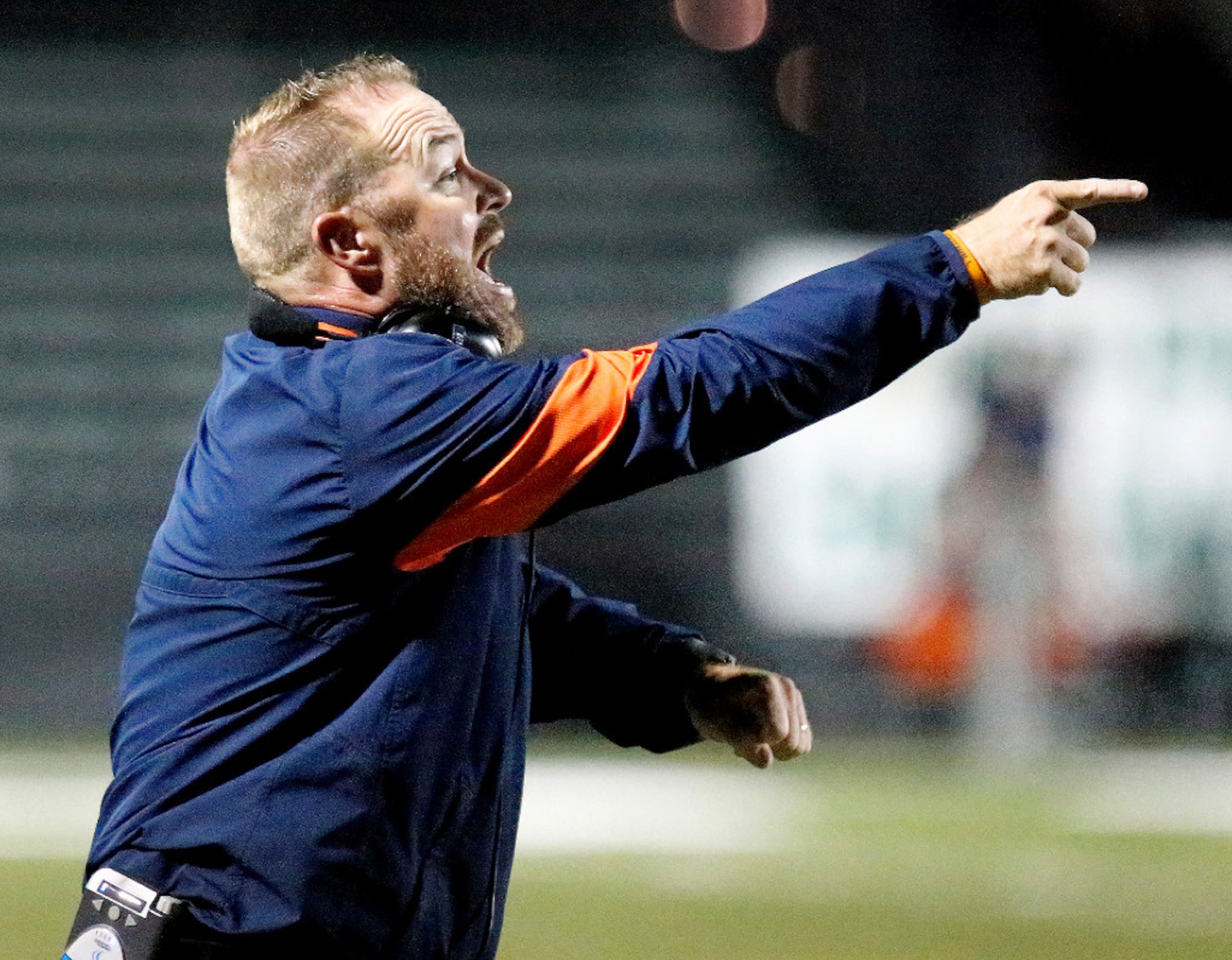 McKinney North High School head coach Mike Fecci shouts at the refs during the first half as...