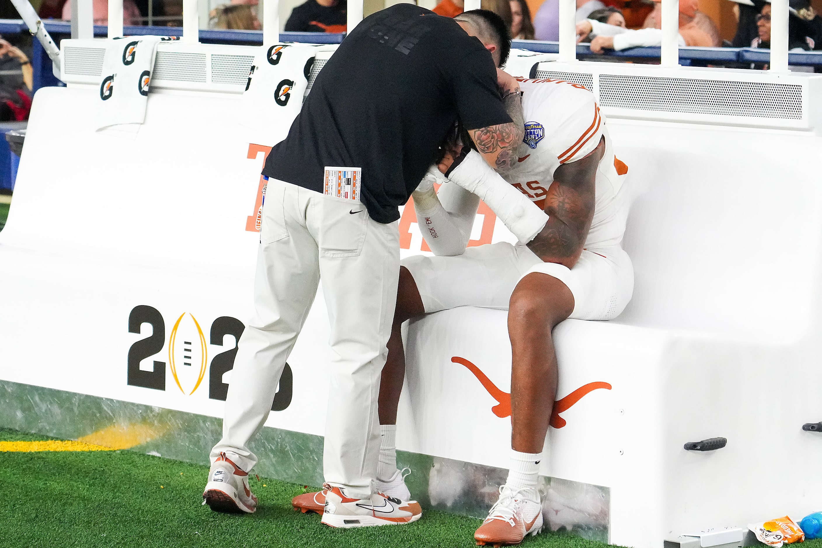 Texas linebacker Morice Blackwell Jr. is consoled on the bench after a loss to Ohio State in...