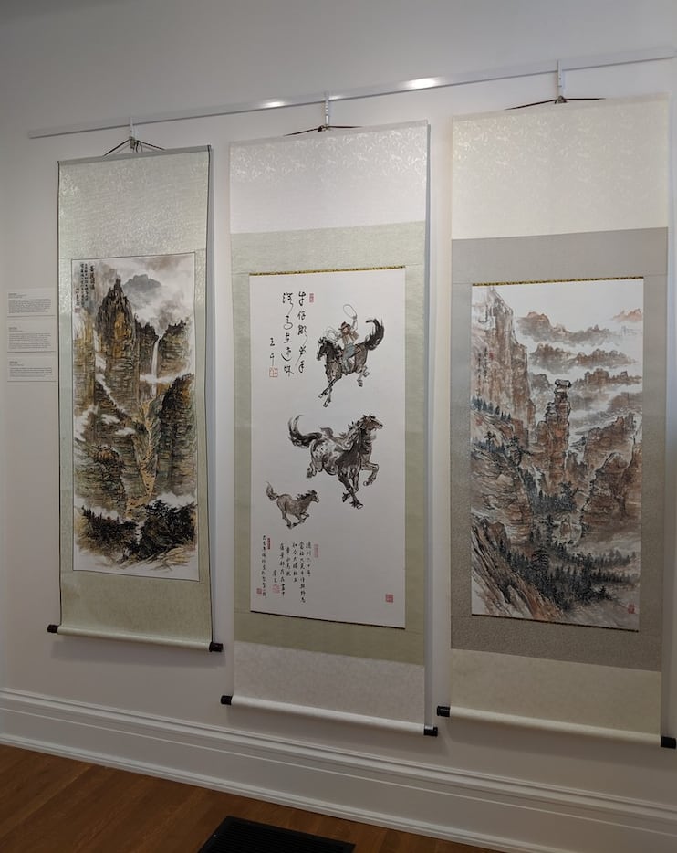 Three of artist Jenney Chang's paintings on display at the ArtCentre of Plano as part of the...