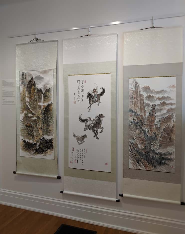 Three of artist Jenney Chang's paintings on display at the ArtCentre of Plano as part of the...