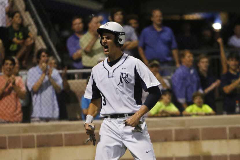 Dallas Jesuit Kyle Muller celebrates after scoring in the bottom of the sixth inning during...