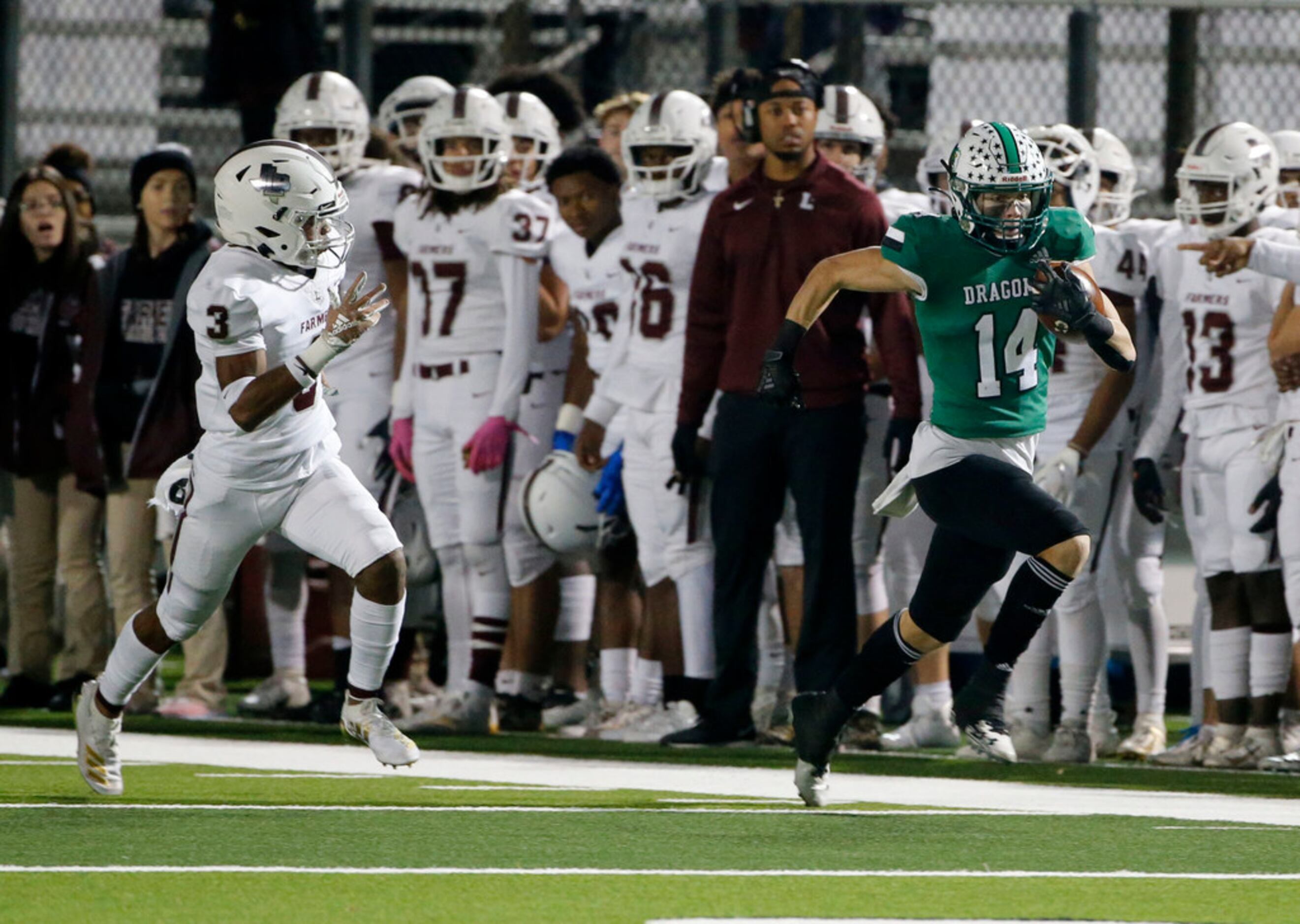 Southlake's Brady Boyd (14) makes a reception and races away from Lewisville defender Julius...