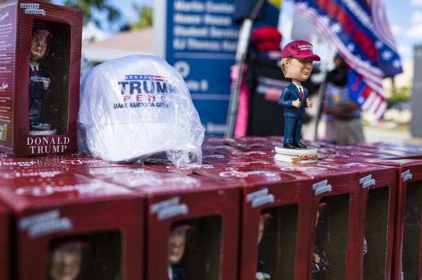 Donald Trump bobblehead dolls were for sale Monday outside the site of his campaign rally at...