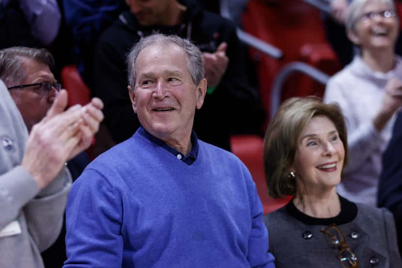 Former President George W. Bush is introduced during a break in the first half against Tulsa...