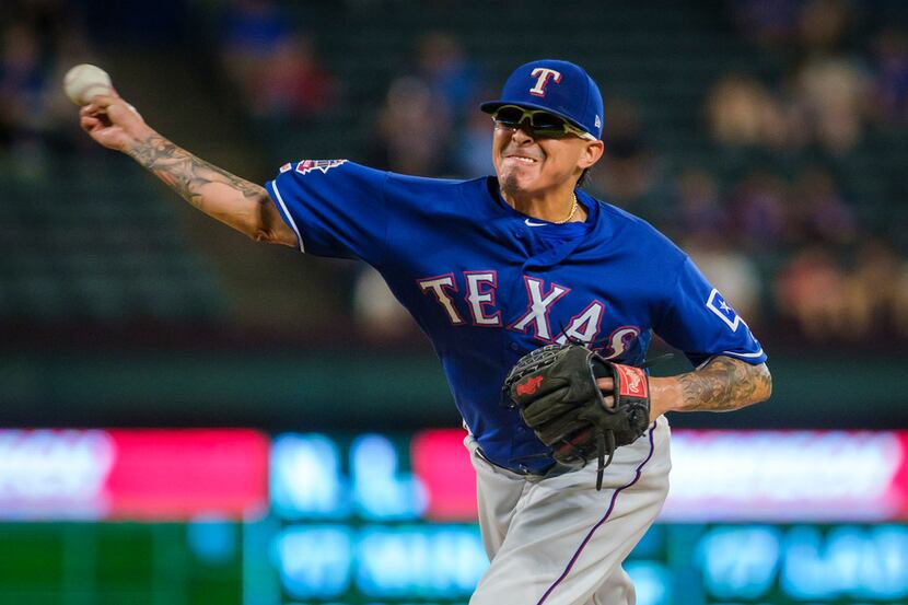 Texas Rangers relief pitcher Jesse Chavez pitches during the ninth inning against the...