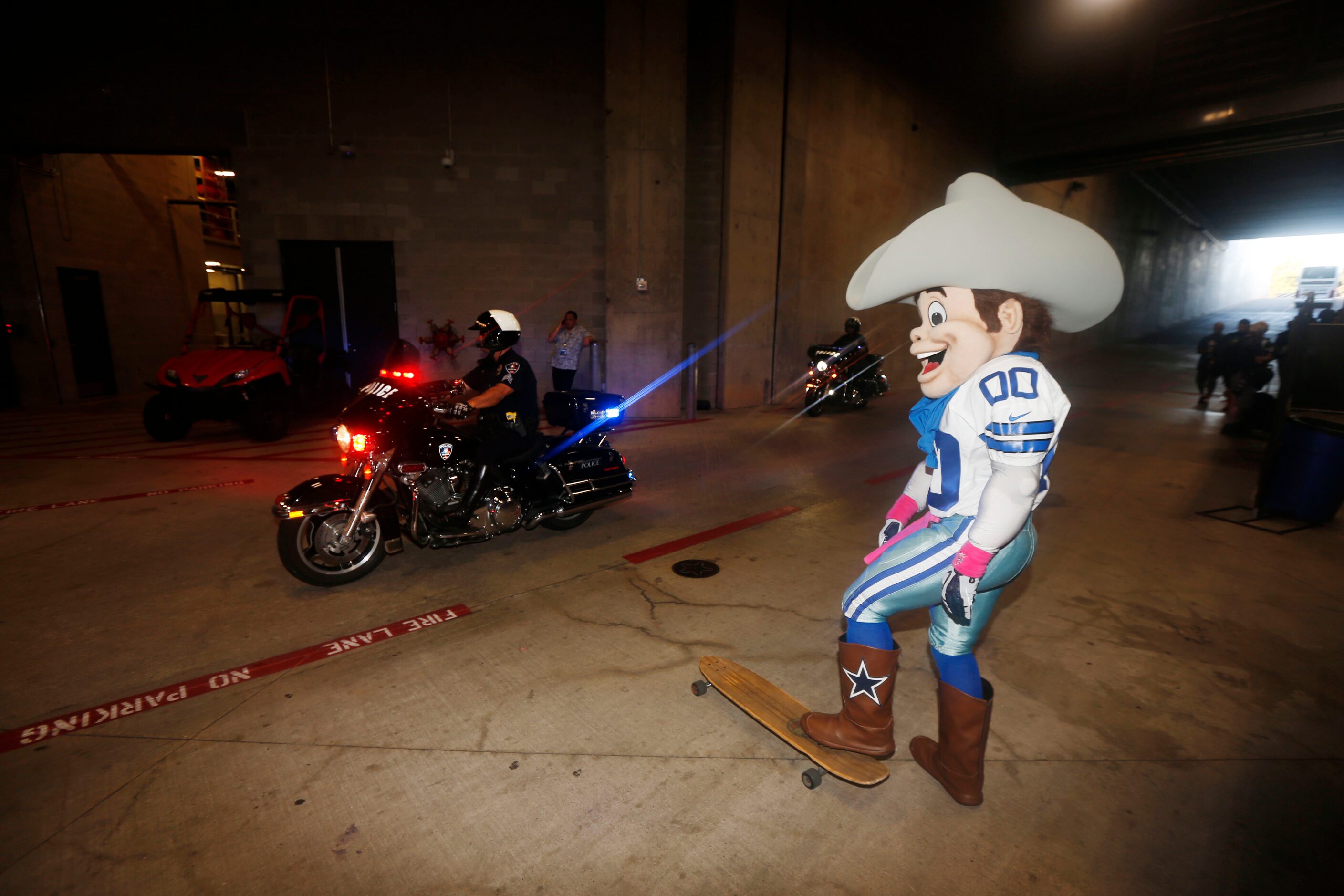 Dallas Cowboys  mascot Rowdy watches as team buses arrive prior to the Dallas...