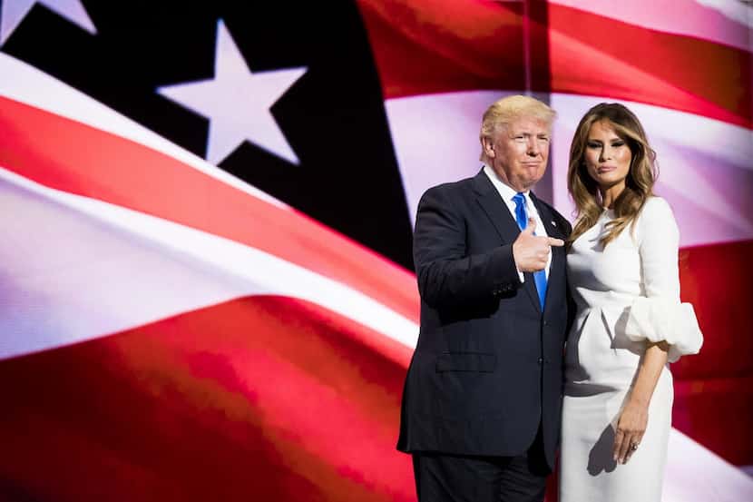 Donald Trump points to his wife Melania Trump after she addressed the Republican National...