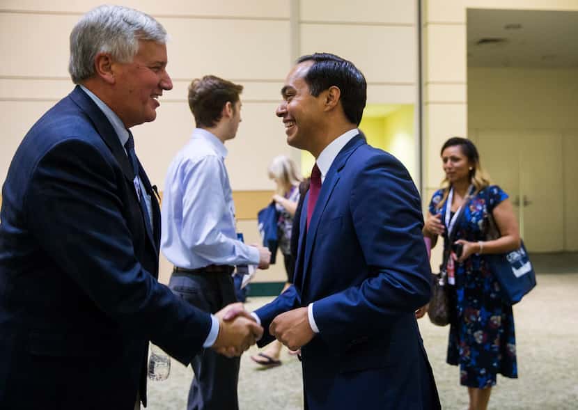 Mike Collier, candidate for Texas lieutenant governor, greeted Julian Castro, former...