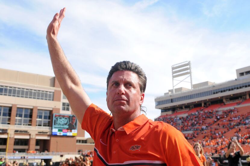 FILE- In this Oct. 29, 2016, file photo, Mike Gundy Oklahoma State head coach Mike Gundy...
