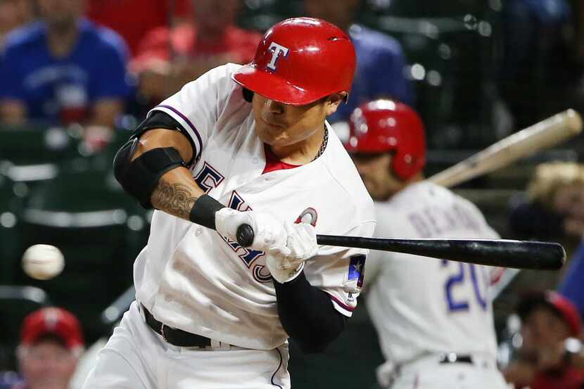 Texas Rangers right fielder Shin-Soo Choo (17) is hit by a pitch in the fifth inning during...