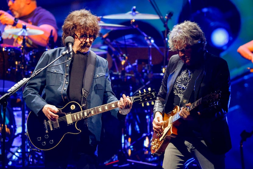 Jeff Lynne (left) performs during the “Over and Out” tour at the American Airlines Center,...