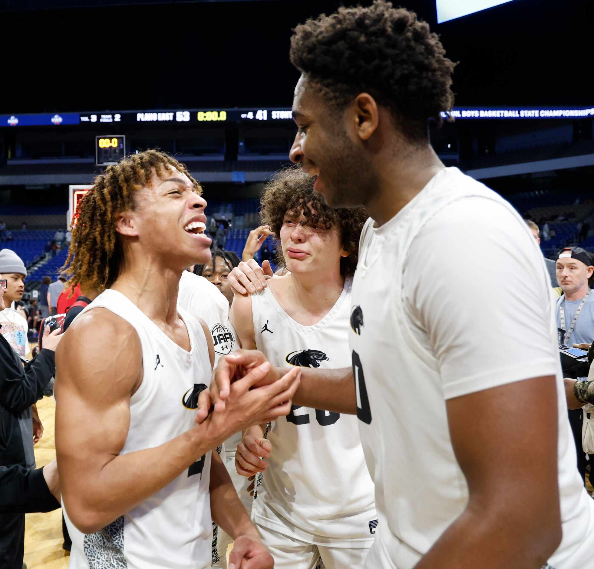 Plano East's Jordan Mizell (4) celebrates with teammate DJ Hall after defeating Round Rock...