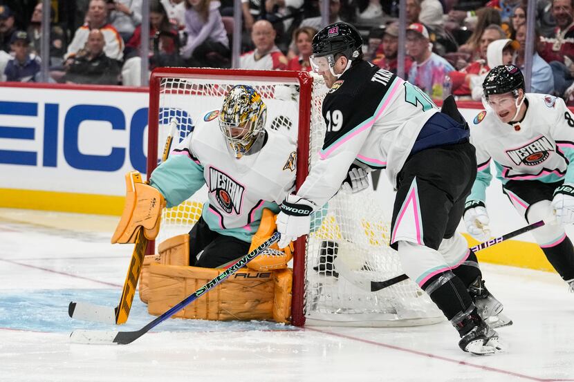 Atlantic Division's Matthew Tkachuk, of the Florida Panthers (19) works against Central...