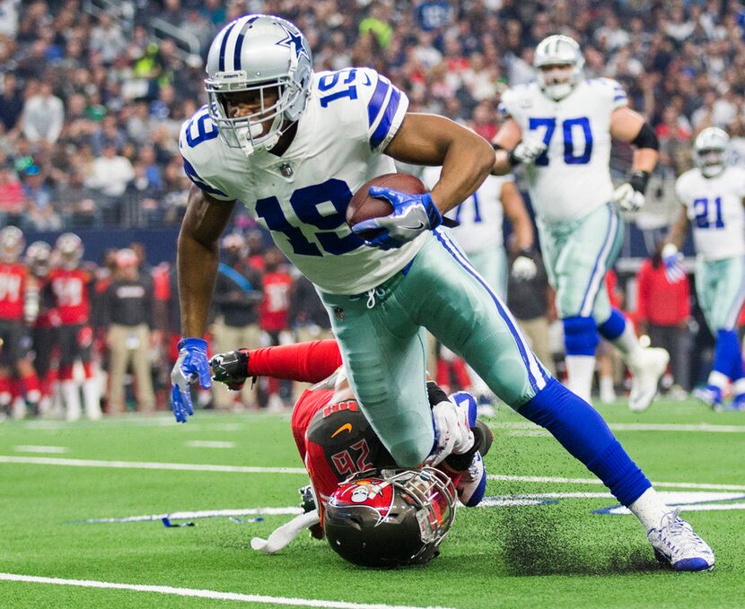 Dallas Cowboys wide receiver Amari Cooper (19) is tackled by Tampa Bay Buccaneers defensive...