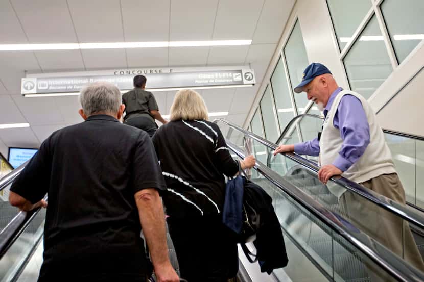 In this Friday, Sept. 20, 2013 photo, Rev. Frank Colladay Jr., right, talks to passengers...
