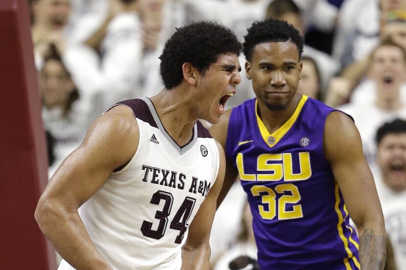 Texas A&M's Tyler Davis (34) yells after making a basket while being fouled, as LSU's Craig...