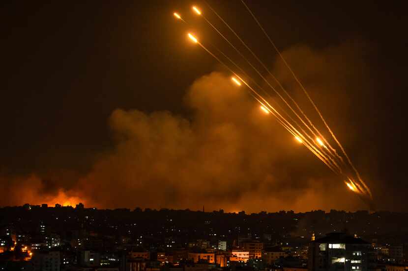 Rockets are fired toward Israel from the Gaza Strip on Oct. 8, 2023. (AP Photo/Fatima Shbair)
