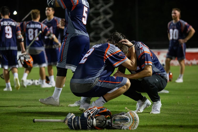 Dallas Rattlers' Jack Near (2) comforts Mike Manley (5) after losing 16-12 to the Denver...