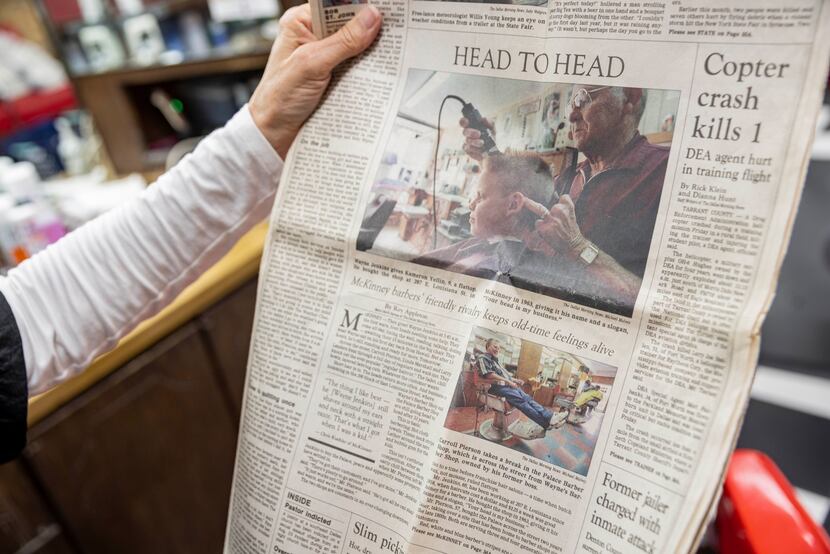 Owner Linda Marshall holds a copy of a Dallas Morning News paper from 1998 that features a...