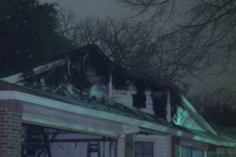 Fire heavily damaged a home in Fort Worth on Monday night, and a 68-year-old woman who was...