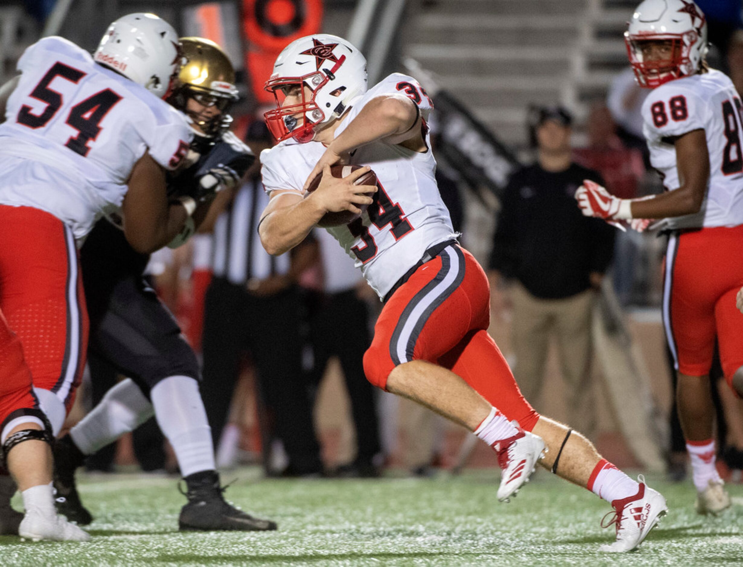 Coppell senior running back Ryan Hirt (34) carries the ball against Irving during the first...