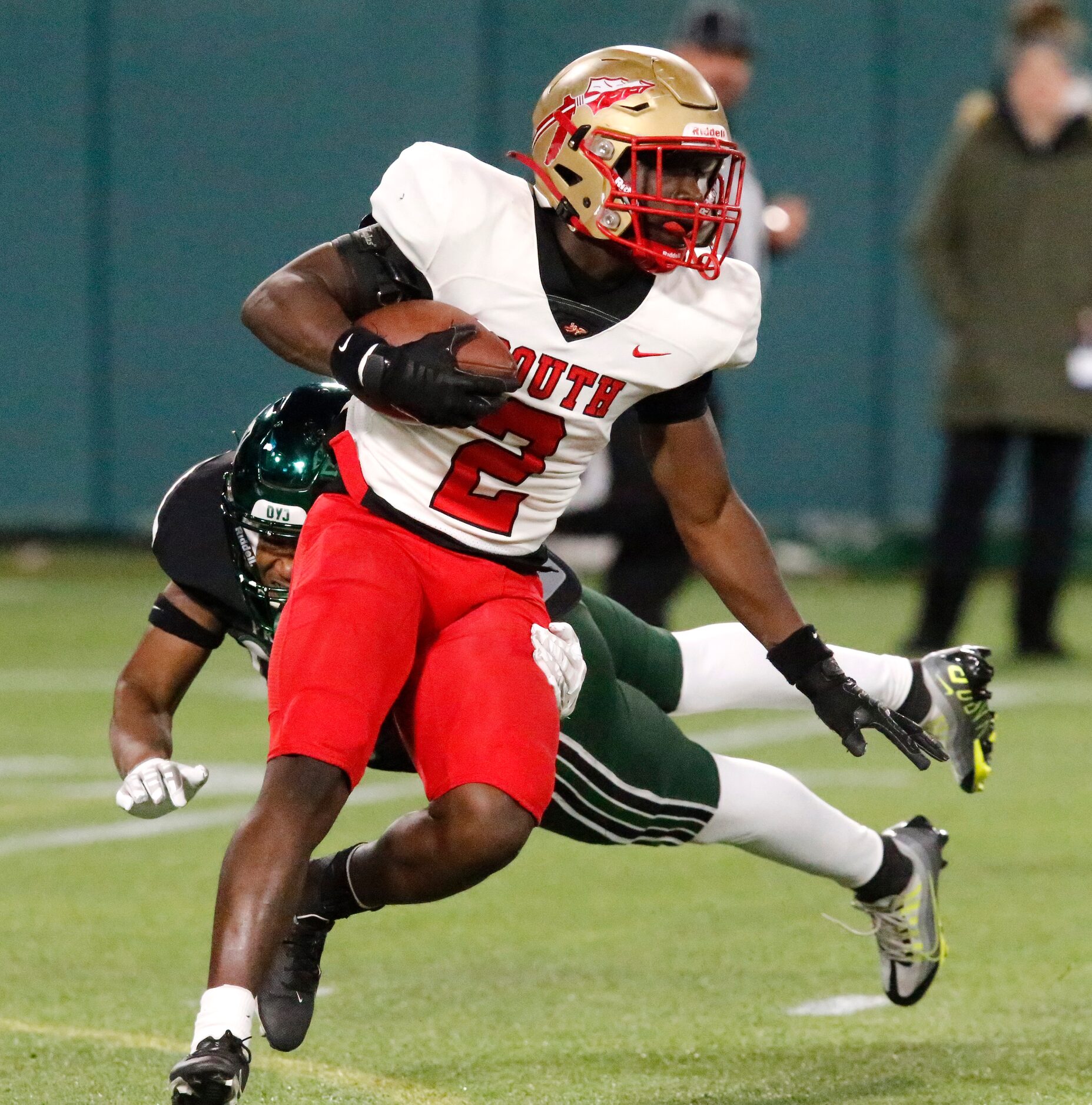 South Grand Prairie High School’s Jeanmarc Sattie (2) returns a kickoff during the first...