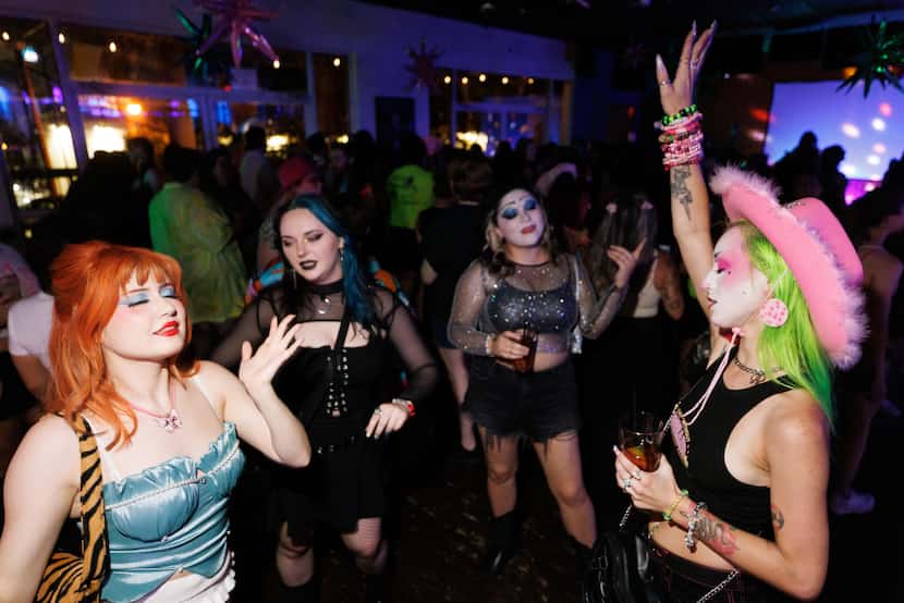 People dance during a Charli XCX and Chappell Roan-themed bar night.