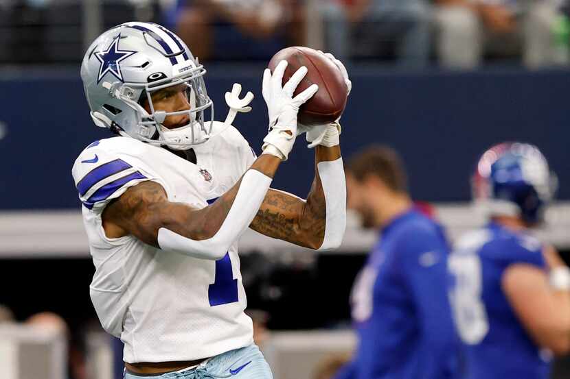 Dallas Cowboys wide receiver Cedrick Wilson (1) catches passes during pregame warmups before...