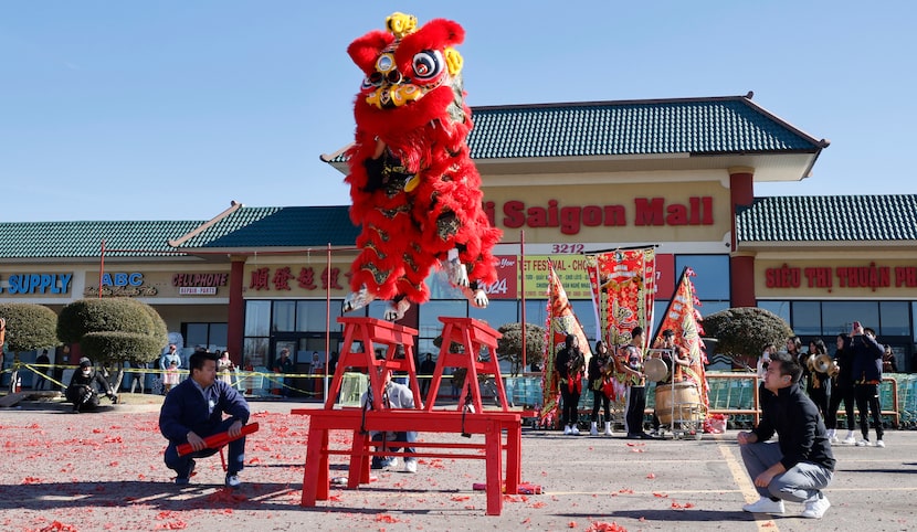 Dancers from Ngoc Nhien Buddhist Youth Association perform lion dance during a Lunar New...