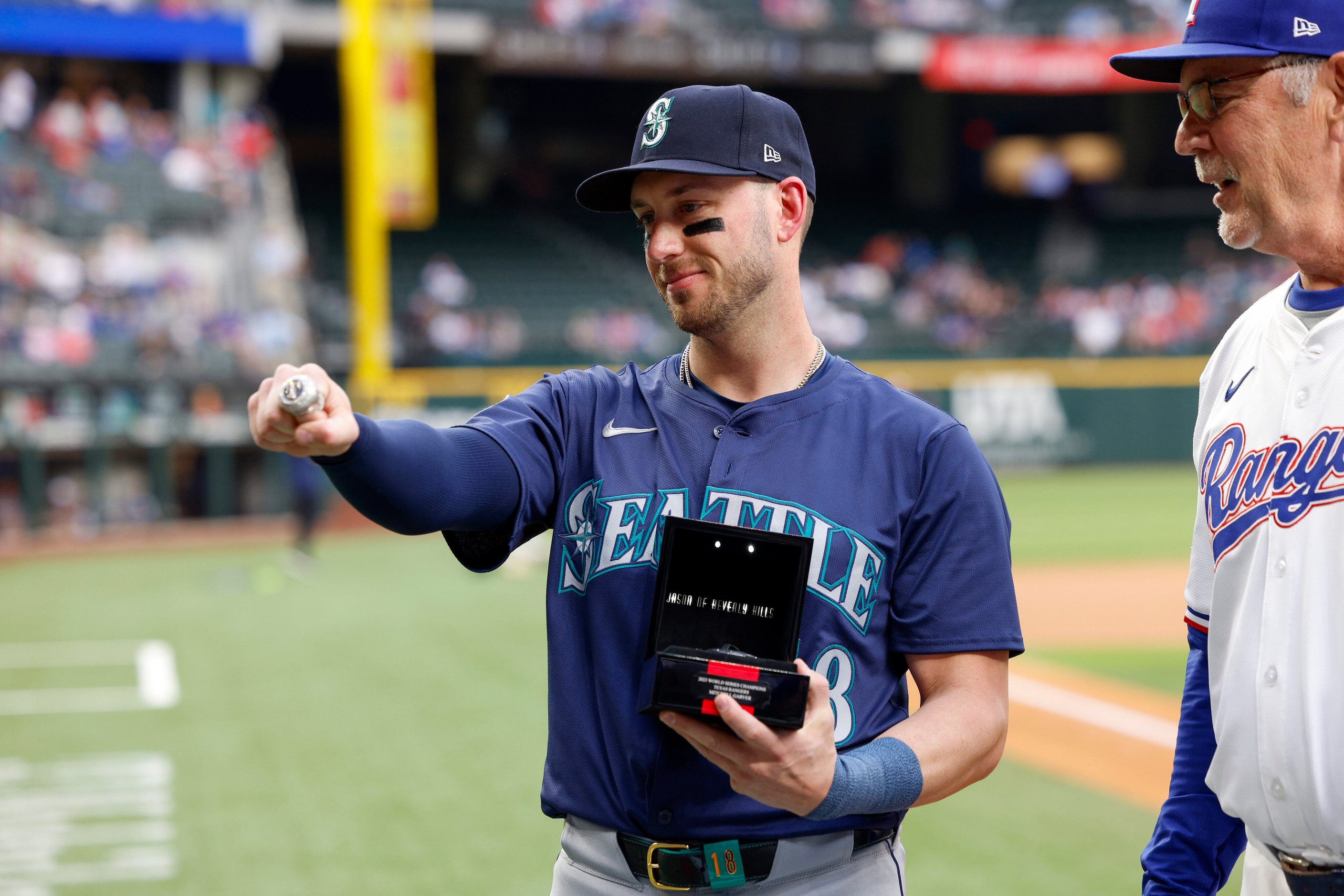 Former Texas Rangers catcher Mitch Garver shows off his 2023 Texas Rangers World Series...