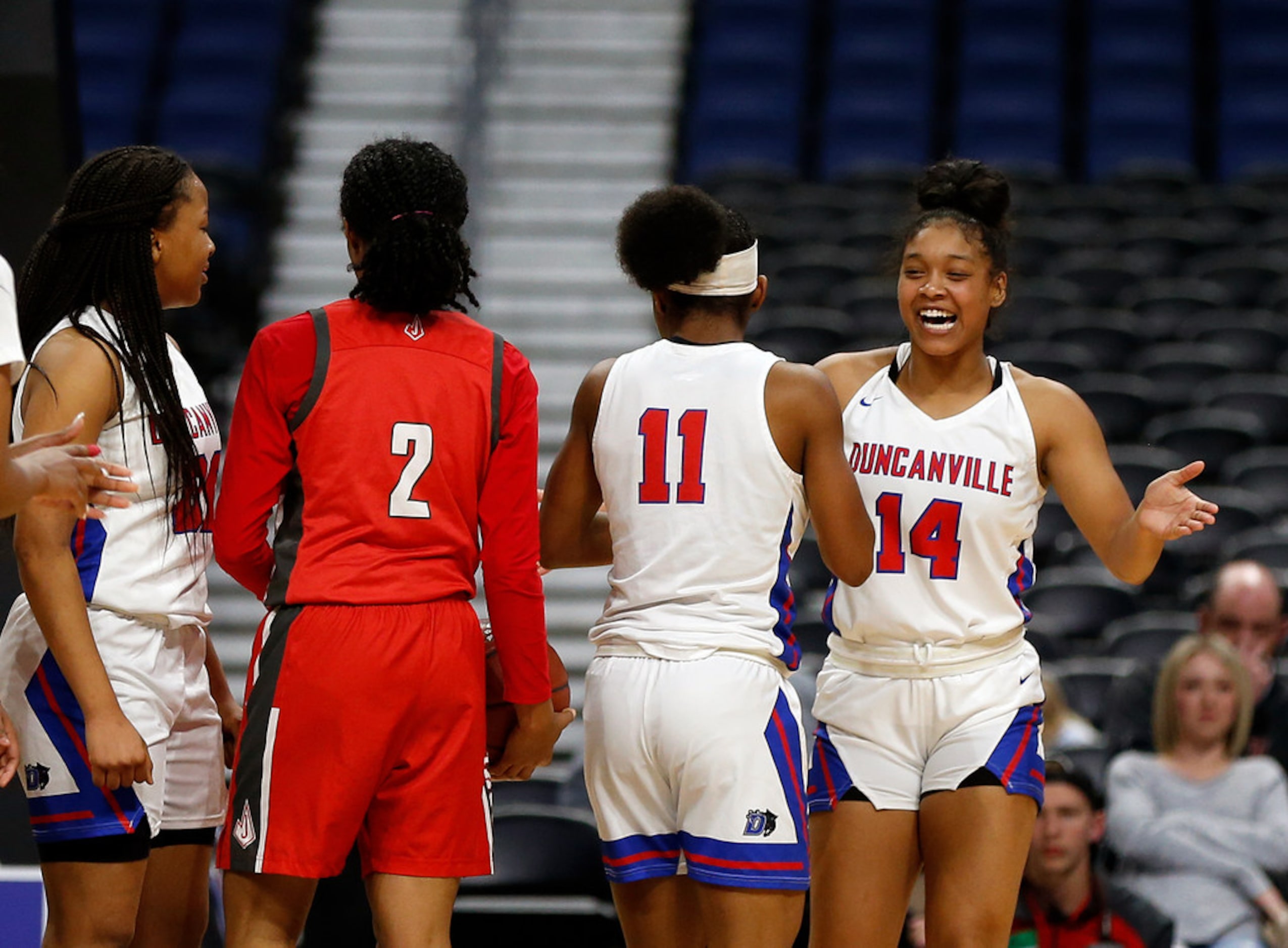 Duncanville guard Kiyara Howard-Garza #14 celebrates with Duncanville guard Tristen Taylor...