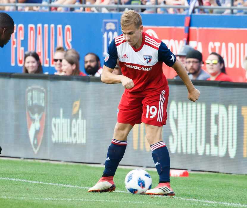 Paxton Pomykal of FC Dallas attempts to keep the ball in bounds against Seattle Sounders....