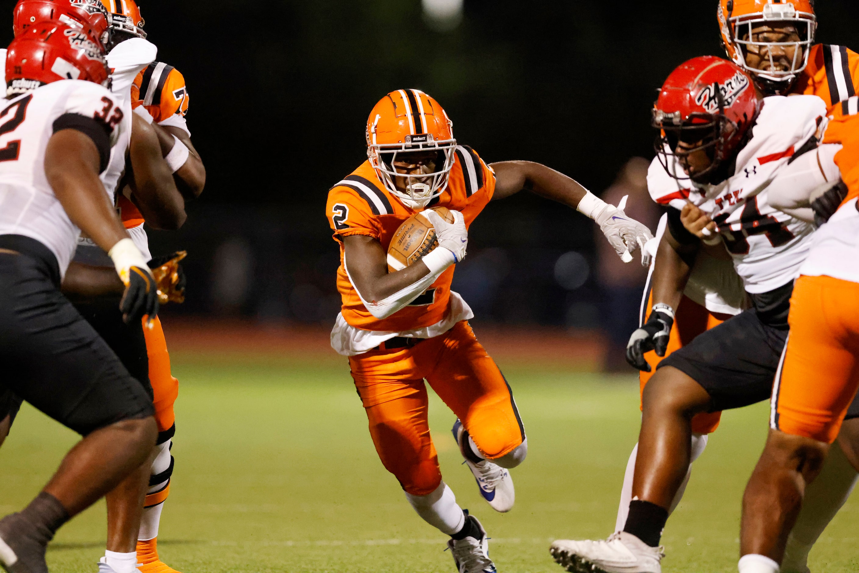 Lancaster running back Izayah Lee (2) runs the ball through the line of scrimmage during the...