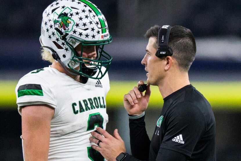 Southlake Carroll quarterback Quinn Ewers (3) talks with head coach Riley Dodge during the...
