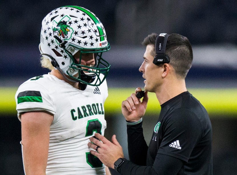 Southlake Carroll quarterback Quinn Ewers (3) talks with head coach Riley Dodge during the...