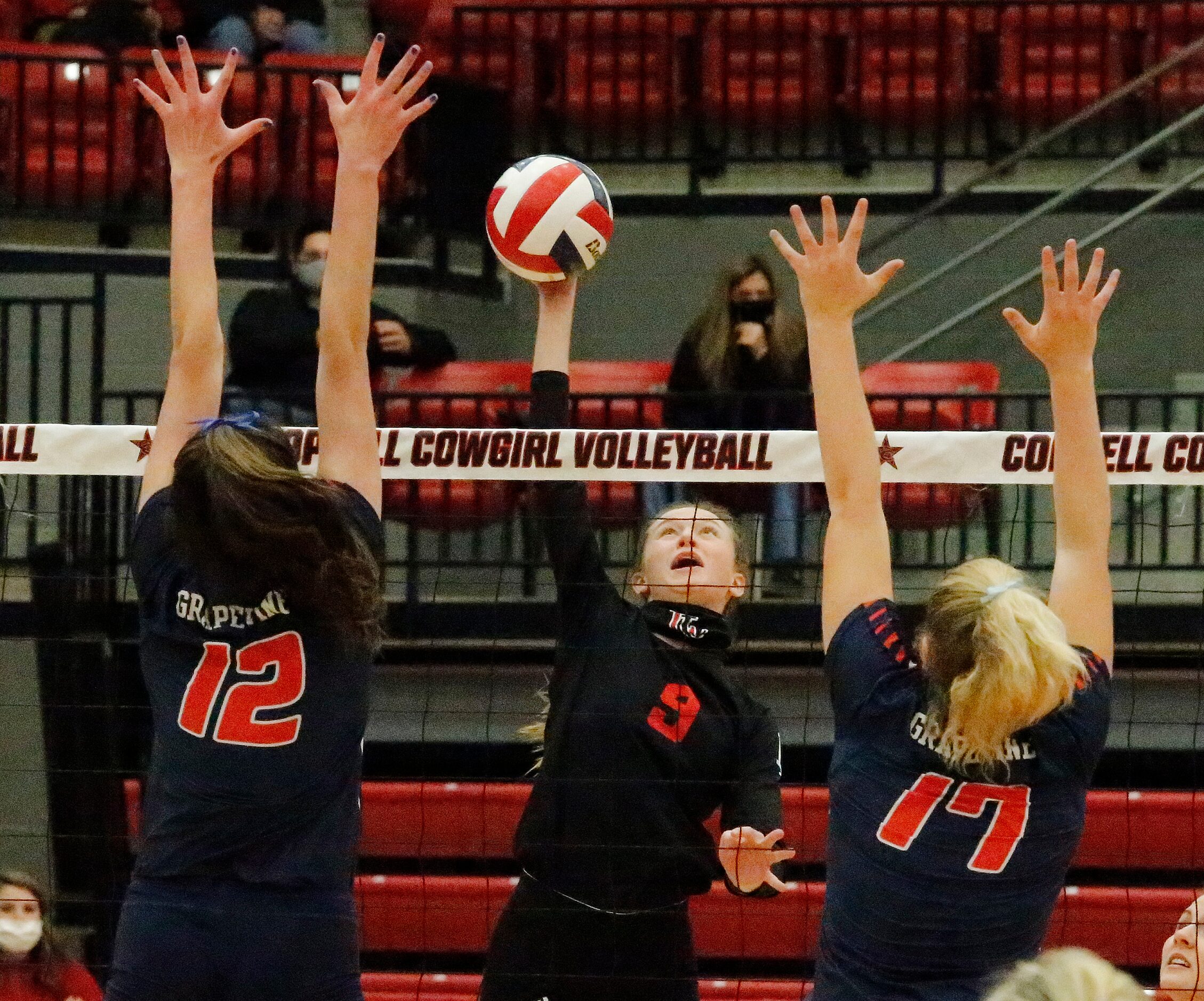 Lovejoy High School setter Averi Carlson (9) gets a hit between Grapevine High School...