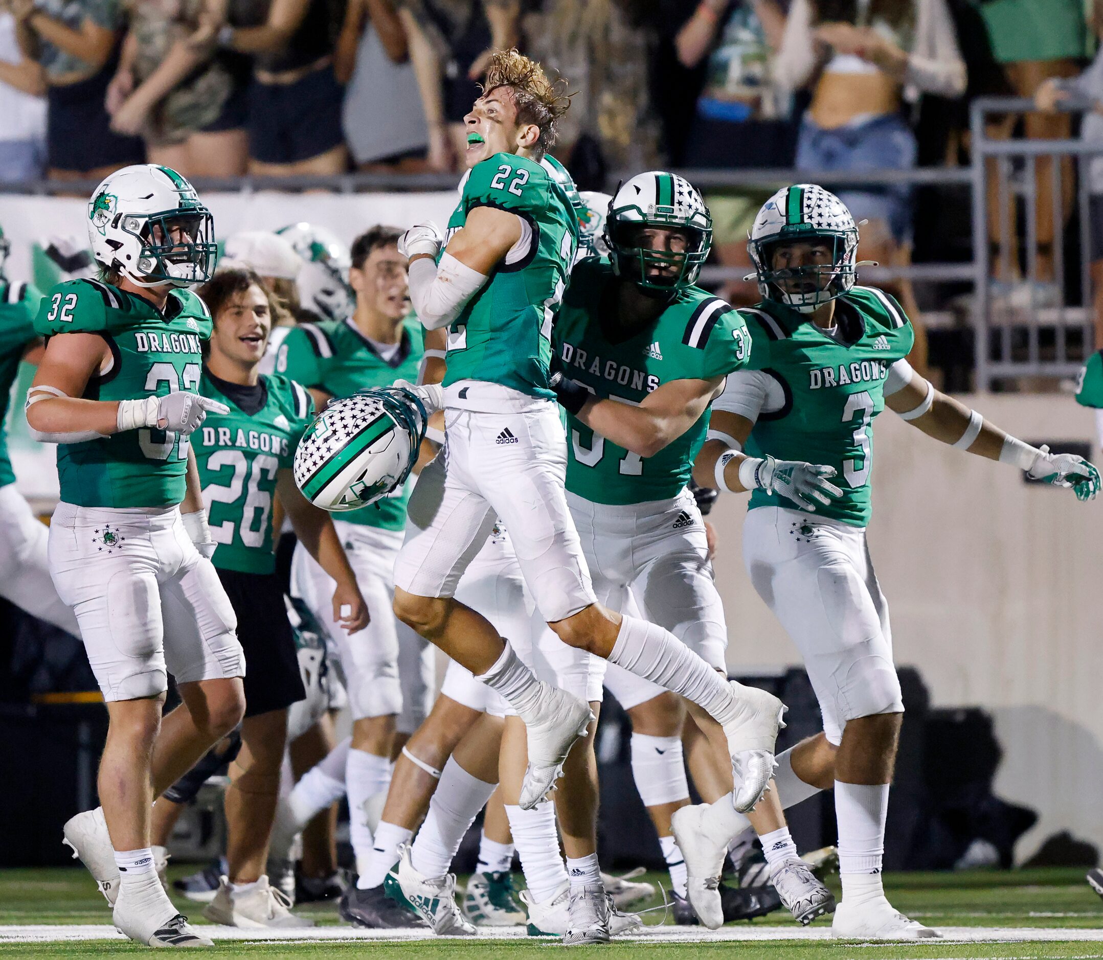 Southlake Carroll defensive back Logan Lewandowski (22) celebrates his fourth quarter...