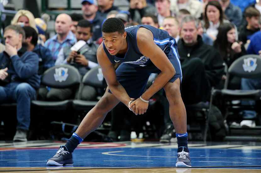 Mavericks point guard Dennis Smith Jr. (1) stretches before a game against the Golden State...