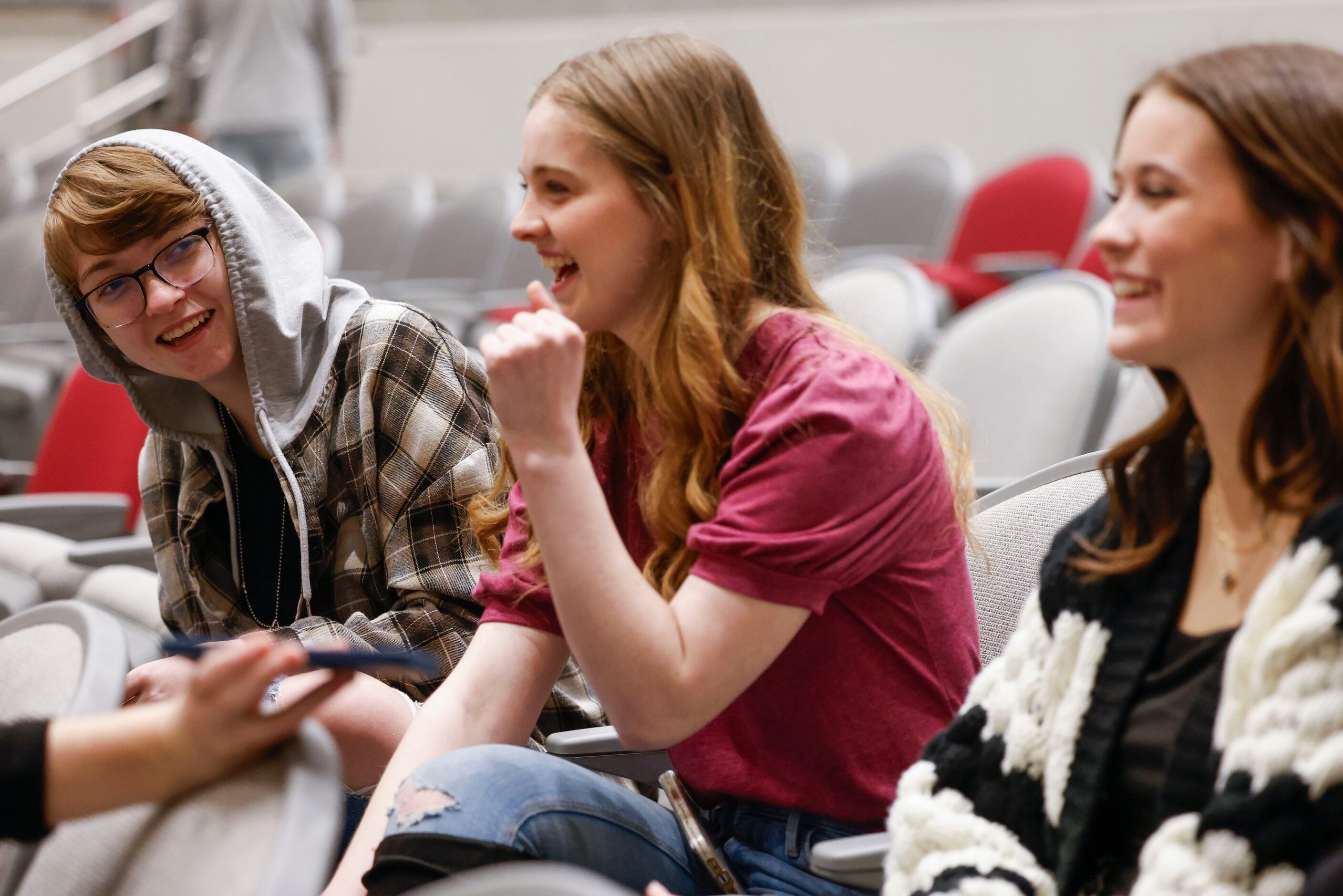 Cast member Max Hightower (left) shares a laugh with his fellow cast members Avery Tollison...